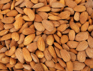 Almonds. Raw fresh organic almond nuts. Almond background. Nuts background. Almond texture and background