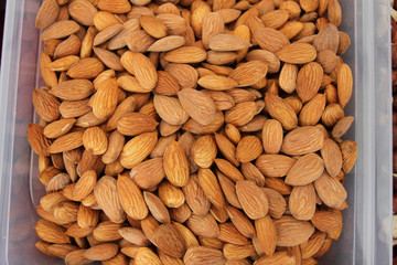 Almonds. Raw fresh organic almond nuts. Almond background. Nuts background. Almond texture and background