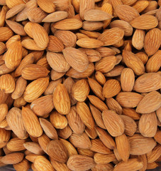 Almonds. Raw fresh organic almond nuts. Almond background. Nuts background. Almond texture and background