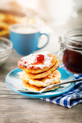 Delicious pancakes on wooden table with Cup of coffee and jam