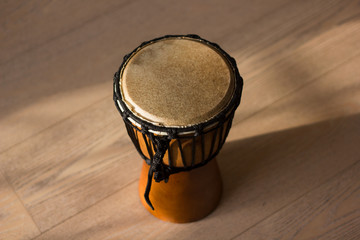 Close up on brown djembe in warm evening light