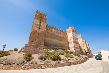 corner side of landmark ancient arab Castle of Burgalimar, from X century, public monument in village Banos de la Encina, Jaen, Andalusia, Spain Europe
