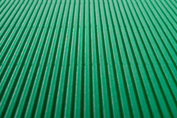 perspective view of cardboard corrugated pattern background at green color