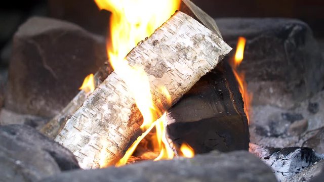 Burning wood in Sami tent close up