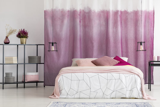 Elegant bedroom with pink curtain