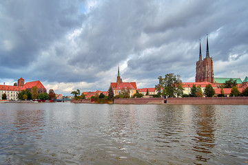 Obraz premium Wroclaw Old Town. Cathedral Island (Ostrow Tumski) Cathedral of St. John and Blessed Virgin Mary Church on Island Piasek and Odra (Oder) river Tumski bridge (Tumski Most).