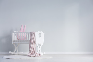 White baby's bedroom with cradle