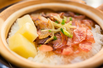 clay pot rice with bacon and sausage and potato