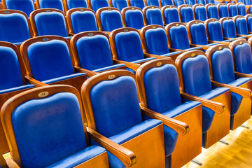 Fototapeta premium Blue brown wooden chairs in the auditorium. Without people.