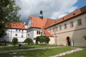 Facade of the Minoritsky klaster (Minorite Monastery) in charming medieval town of Cesky Krumlov, Czech Republic.