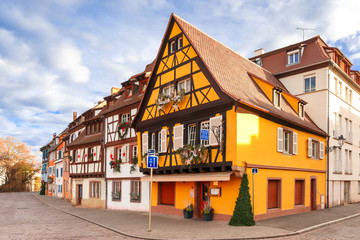 Traditional Alsatian half-timbered houses in Petite Venise or little Venice, old town of Colmar, decorated at christmas time in sunny day, Alsace, France