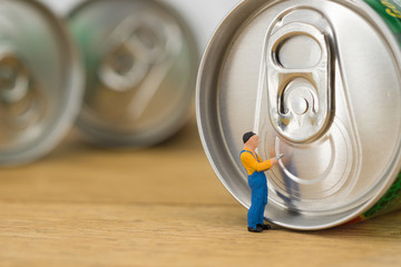 Miniature workman open a can