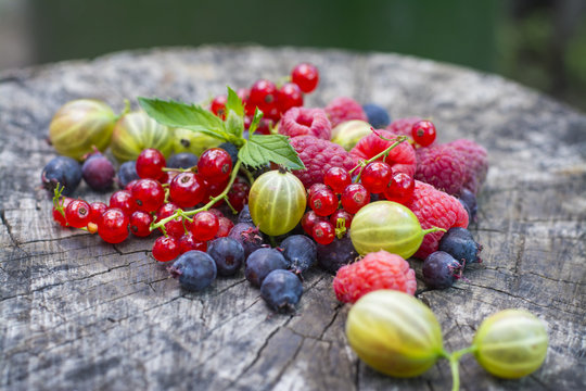 Berries. Ripe beautiful berries on a wooden background.