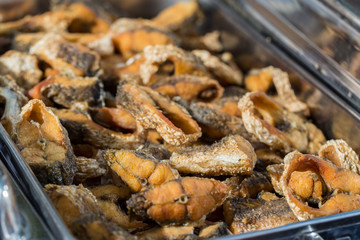 Fried fish until golden brown. Close up.