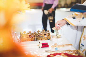 Golden crowns lying on the table in church