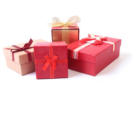 Gift boxes with bow and christmas decoration on wood background