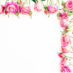 Floral border pattern of pink roses on white background. Flat lay, Top view.