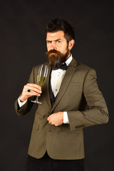 Macho in retro suit cheers with drink. New year eve