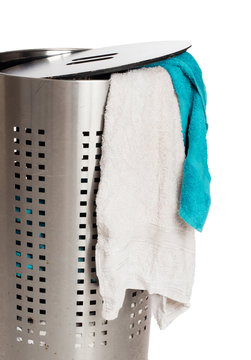 Dirty laundry in a metal basket