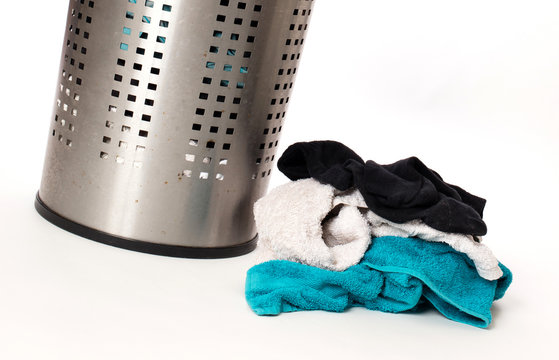 Dirty laundry in a metal basket