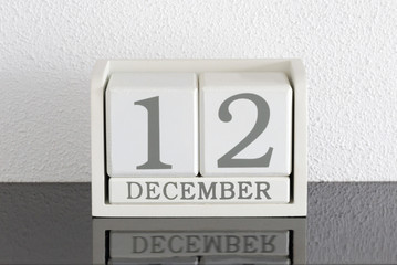 White block calendar present date 12 and month December