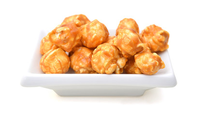 Caramel popcorn on a white background