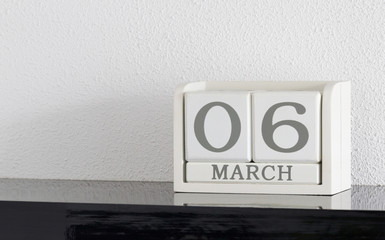 White block calendar present date 6 and month March