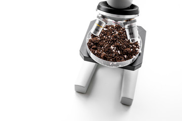 Analysis process. Soil under microscope on white background copyspace