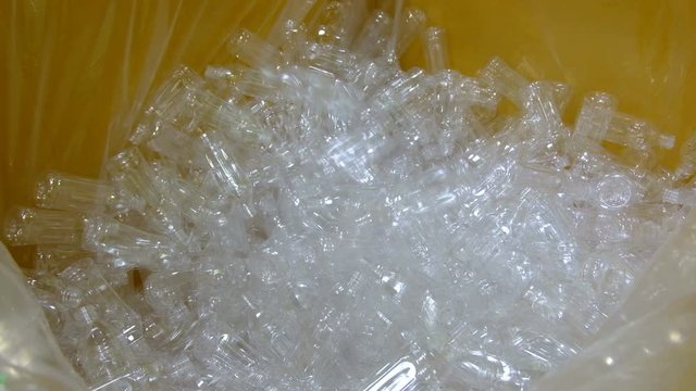 PET bottle blowing. The operation of PET bottle or plastic bottle blowing machine with lighting effect.