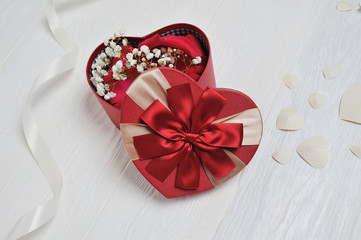 Fototapeta na wymiar Heart Shaped Red Box for St. Valentine's Day in rustic style with place for your text, Flat lay, top view photo mock up