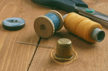 Thread coils and thimble, needle