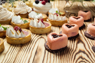 candy bar decorated by delicious sweet buffet with cupcakes and other desserts/candies,happy birthday concept