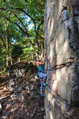 girl climber on a rock.