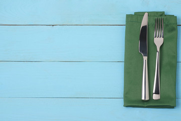 Cutlery on a napkin, knife, fork, top view