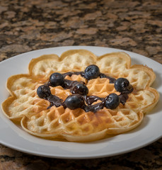 Norwegian waffles on plate with blueberries