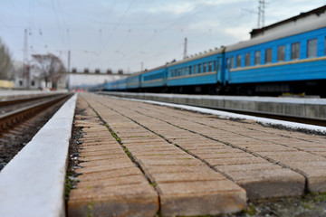 Fototapeta na wymiar Passenger and freight train. Passenger diesel train traveling speed railway wagons journey light