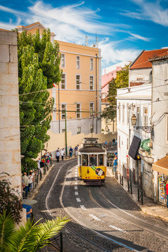 Yellow tram 28 on streets of Lisbon, Portugal