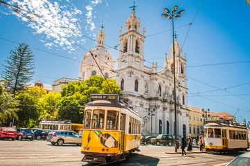 Fotobehang Yellow tram 28 on streets of Lisbon, Portugal © Filip