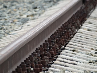 Fastening rails to sleepers