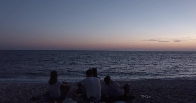 SARDINIA, ITALY  – JULY 2016 : Video shot of people having fun and drinking on Arutas Beach during beautiful sunset