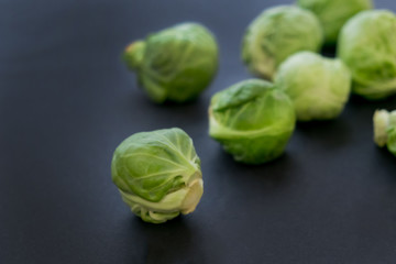 fresh raw brussels sprouts on a wooden table