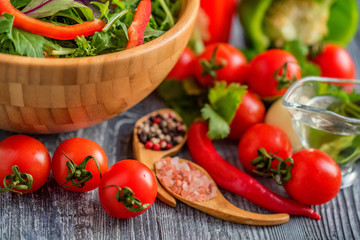 Fresh rustic vegetable salad on rustic background