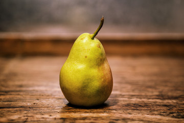 pear on a rustic wooden table