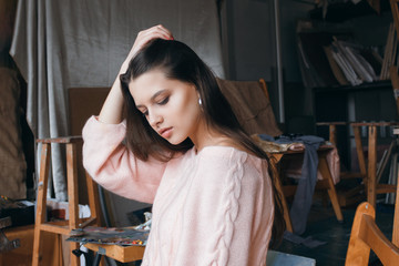  Young beautiful artist girl in the art studio
