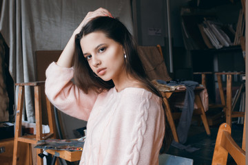  Young beautiful artist girl in the art studio