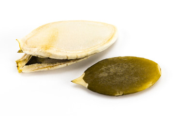 Pumpkin seeds or pepitas, isolated on white background. Overhead view