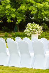 Many wedding chairs with white elegant covers