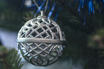 Christmas tree globe ornament. Baubles on fir tree branches.