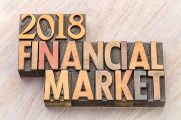 2018 financial market word abstract in wood type