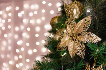 Christmas tree with toys, lights, garland, bokeh on background